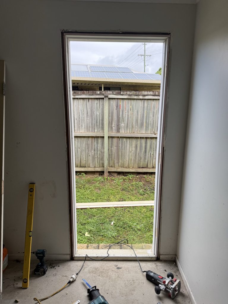Door frame work in progress with the door removed