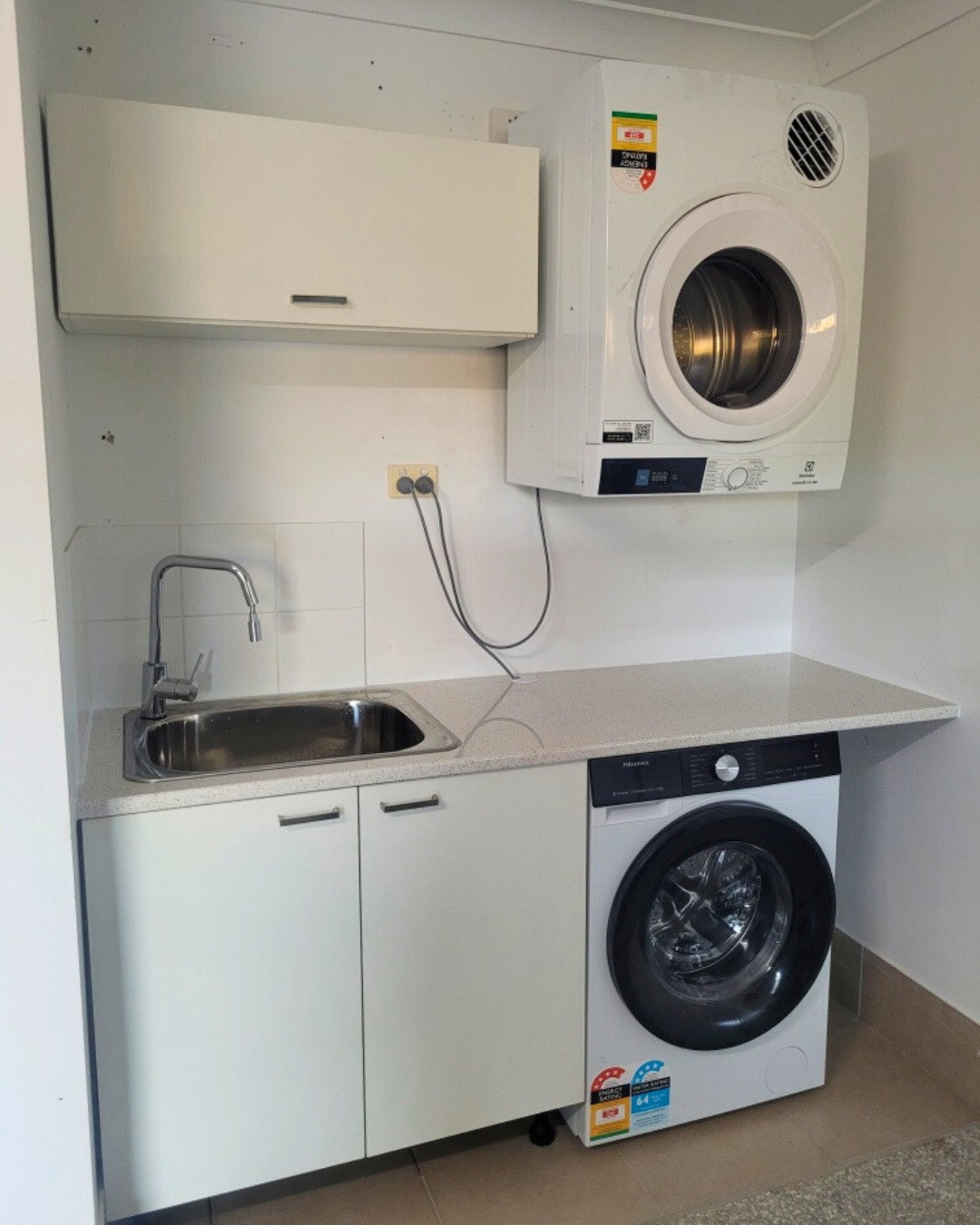 Laundry after new cabinetry and benchtop installation