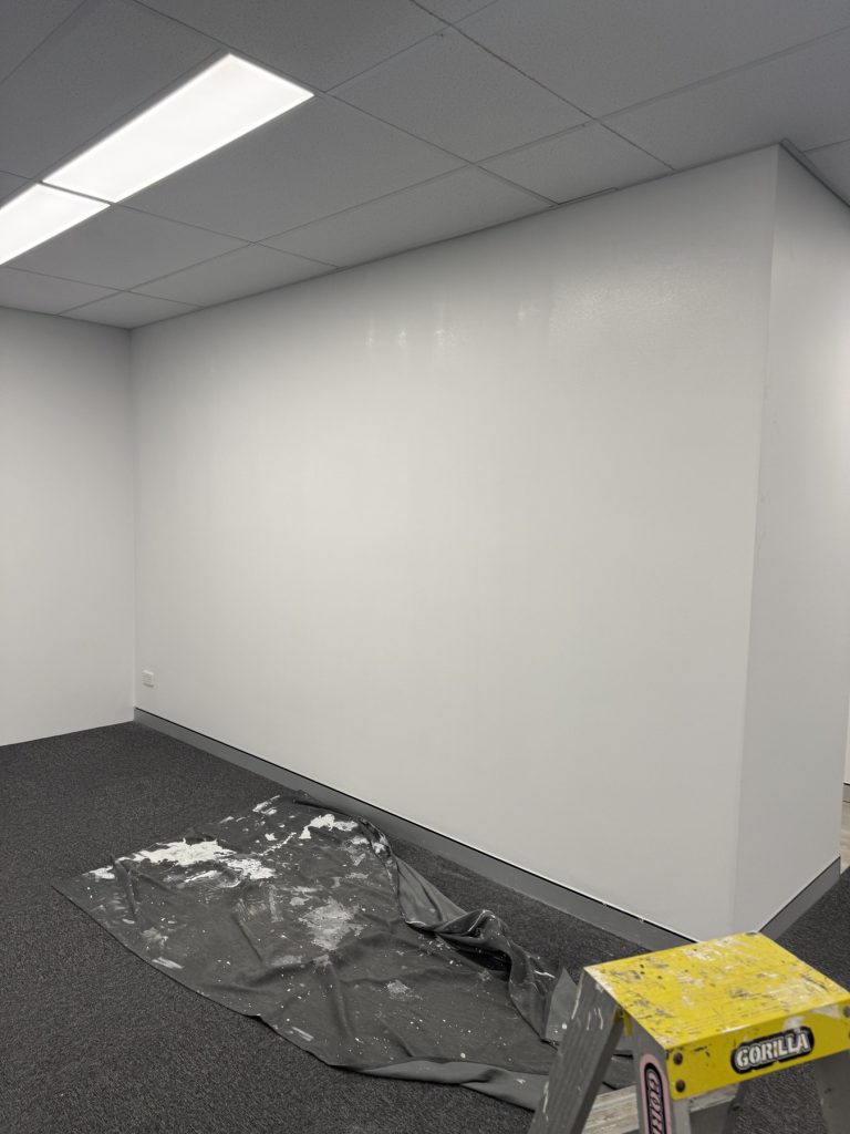 Office wall after patching and repainting
