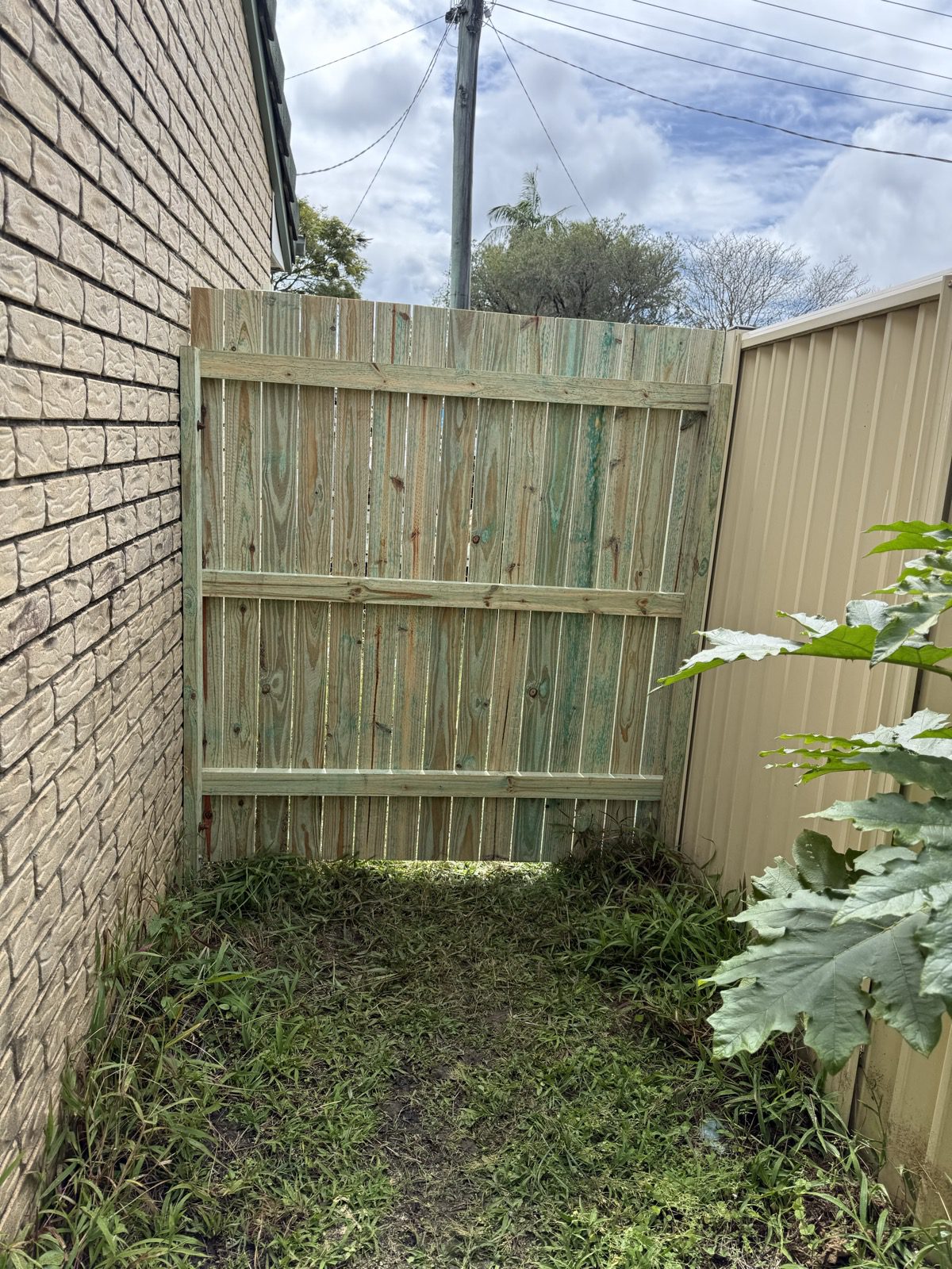 Rear of a timber side gate showing horizontal rails